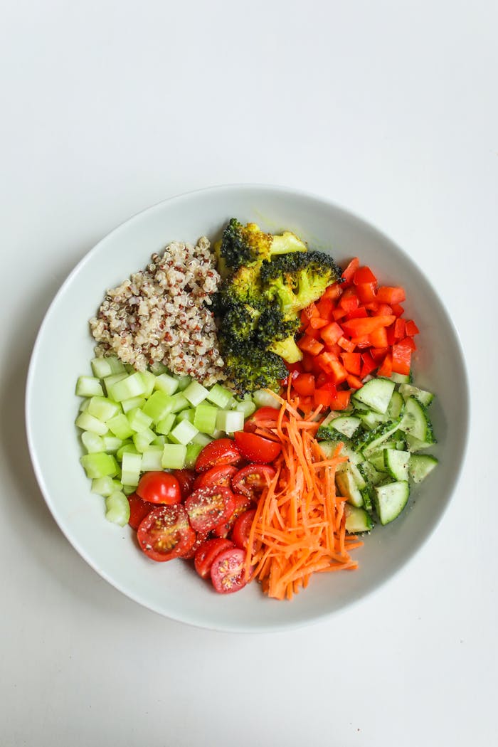 who-we-are Colorful vegetable salad with quinoa, ideal for a healthy diet.